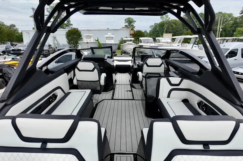 Slide: The Image of Interior view of 2025 Yamaha 275 SD boat with modern seating and sleek design. - 9