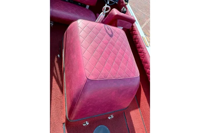 Slide: The Image of 1981 SKI NAUTIQUE Nautique boat interior with red diamond-stitched upholstery and steering wheel. - 20