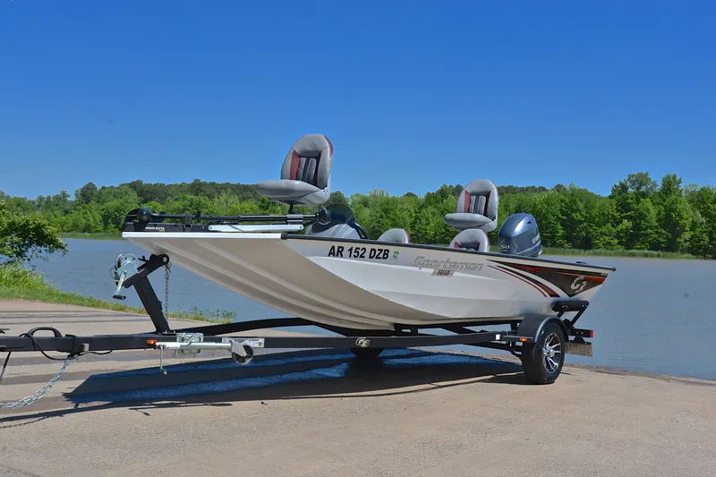 Slide: The Image of 2023 G3 Sportsman 1610 boat on trailer by a scenic lake. - 10