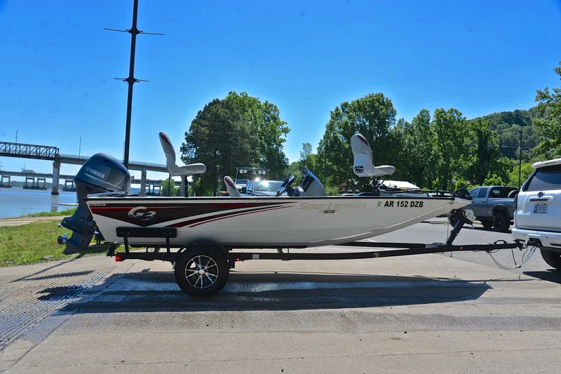 Slide: The Image of 2023 G3 Sportsman 1610 boat on trailer by riverside, sunny day. - 15