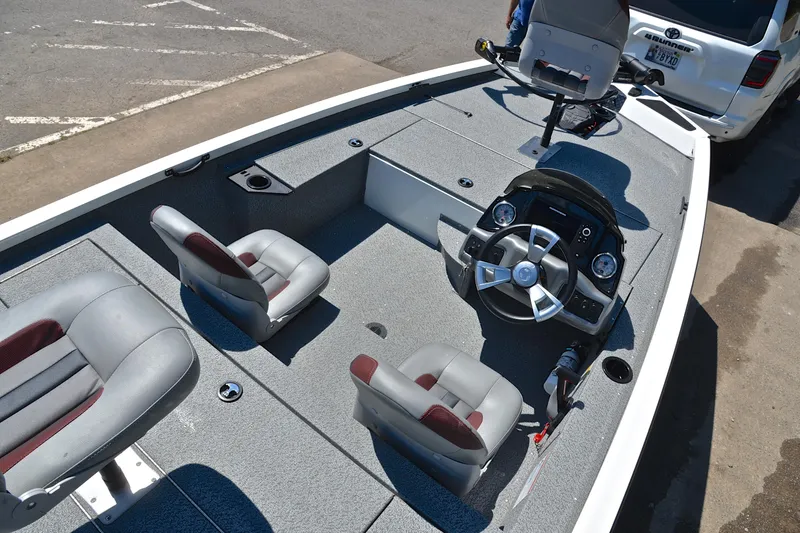 Slide: The Image of 2023 G3 Sportsman 1610 boat interior with steering console and seating. - 20