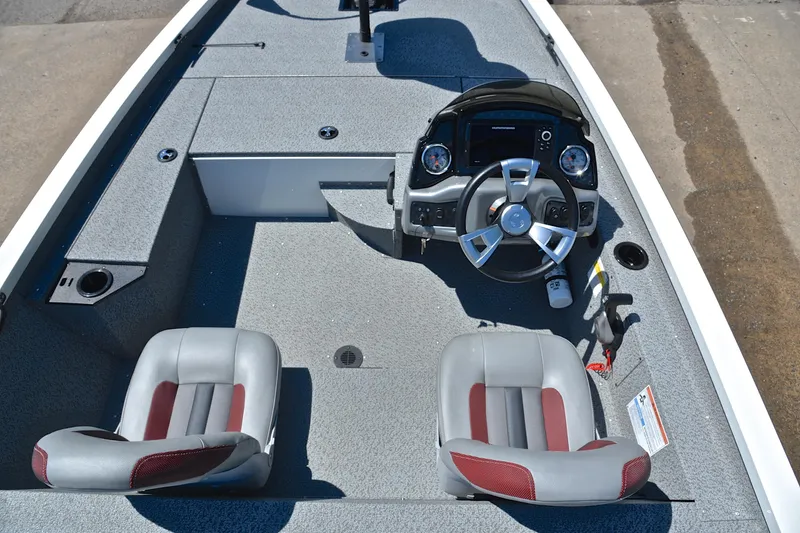 Slide: The Image of 2023 G3 Sportsman 1610 boat interior with steering wheel and dual seats. - 23