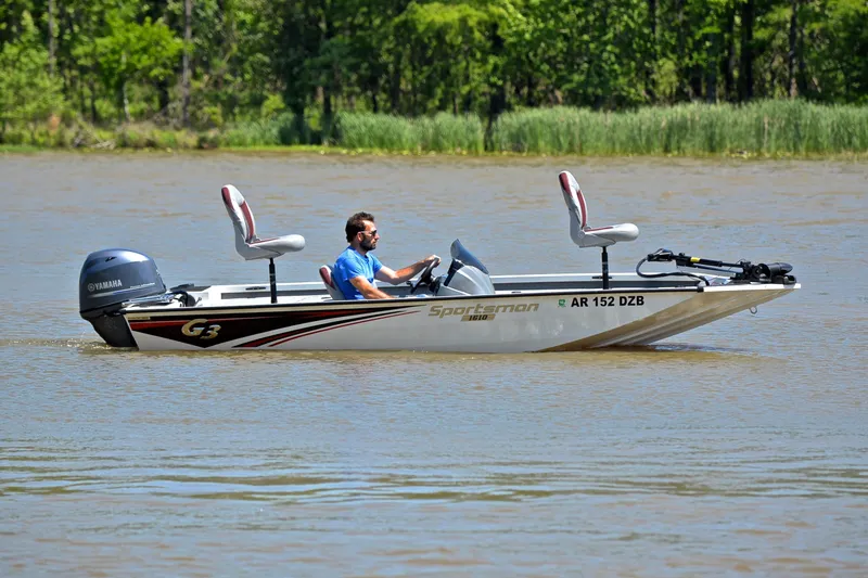 Slide: The Image of 2023 G3 Sportsman 1610 boat on a lake with a Yamaha motor. - 7