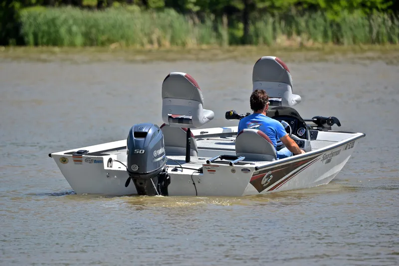 Slide: The Image of 2023 G3 Sportsman 1610 boat with Yamaha motor on a calm lake. - 8