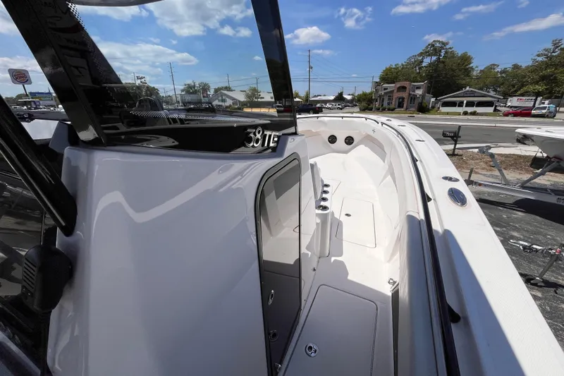 Slide: The Image of 2025 Fountain 38 Tournament Edition boat, sleek design, docked under clear blue sky. - 10