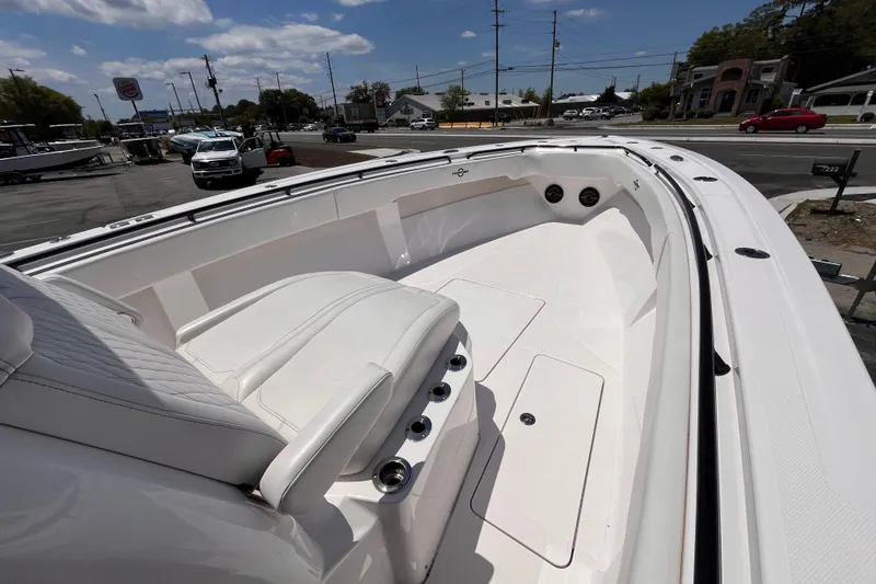 Slide: The Image of 2025 Fountain 38 Tournament Edition boat with sleek white interior and seating. - 11