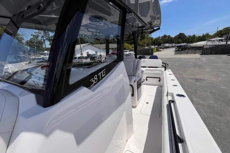 Slide: The Image of 2025 Fountain 38 Tournament Edition boat, docked with sleek design and spacious deck. - 14