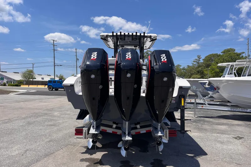Slide: The Image of 2025 Fountain 38 Tournament Edition boat with triple 400R engines, parked outdoors. - 4