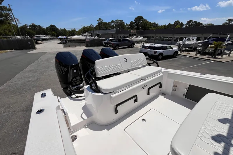 Slide: The Image of 2025 Fountain 38 Tournament Edition boat with dual engines, parked in a marina. - 6