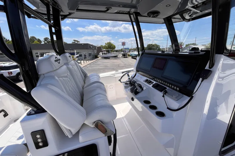 Slide: The Image of 2025 Fountain 38 Tournament Edition boat cockpit with advanced navigation screens and luxurious seating. - 8