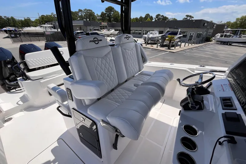 Slide: The Image of 2025 Fountain 38 Tournament Edition boat with luxurious white seating and modern controls. - 9