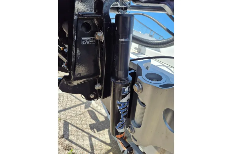 Slide: The Image of Close-up of a 2018 Boca Bay 224 Bay boat engine component. - 12
