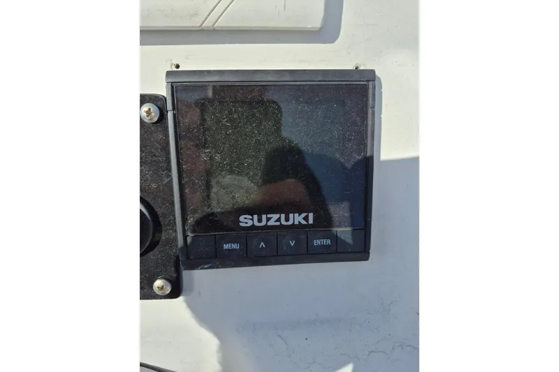 Slide: The Image of Suzuki display panel on 2018 Boca Bay 224 Bay boat dashboard. - 15