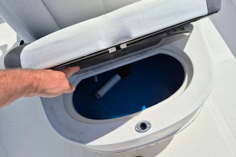 Slide: The Image of Open storage compartment on a 2018 Boca Bay 224 Bay boat. - 21