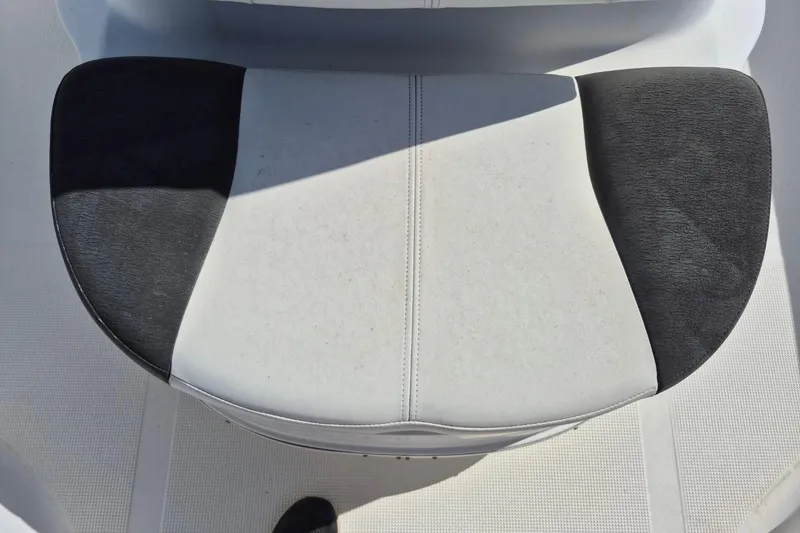 Slide: The Image of Boat seat on a 2018 Boca Bay 224 Bay, featuring black and white upholstery. - 22