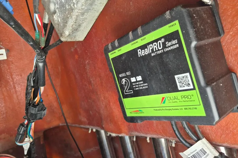Slide: The Image of Battery charger in a 2018 Boca Bay 224 Bay boat, featuring RealPRO Series model RS2. - 25