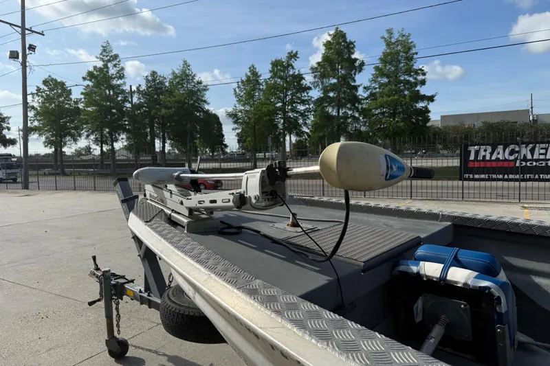 Slide: The Image of 2005 Scully 18 cc boat with trolling motor on trailer, parked outdoors. - 12