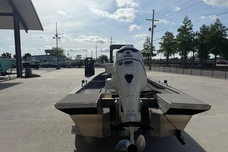 Slide: The Image of 2005 Scully 18 cc boat with outboard motor in a parking lot. - 7