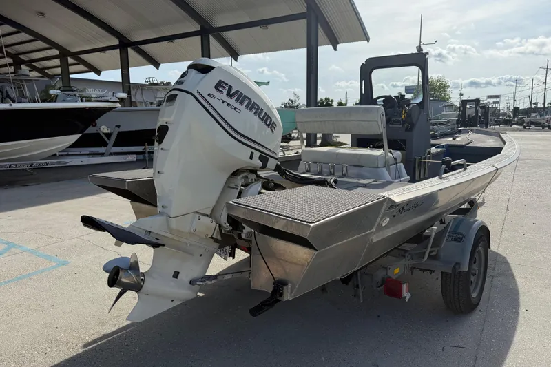 Slide: The Image of 2005 Scully 18 cc boat with Evinrude E-TEC outboard motor on trailer. - 8