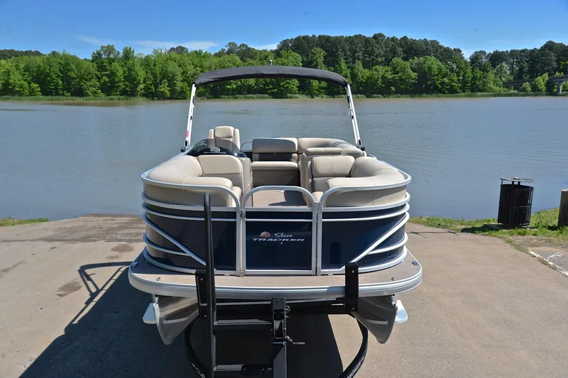 Slide: The Image of 2022 Sun Tracker Party Barge 20 DLX pontoon boat by a scenic lake. - 17