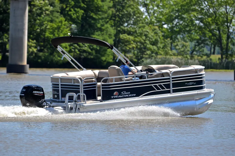 Slide: The Image of 2022 Sun Tracker Party Barge 20 DLX pontoon boat cruising on a lake. - 5