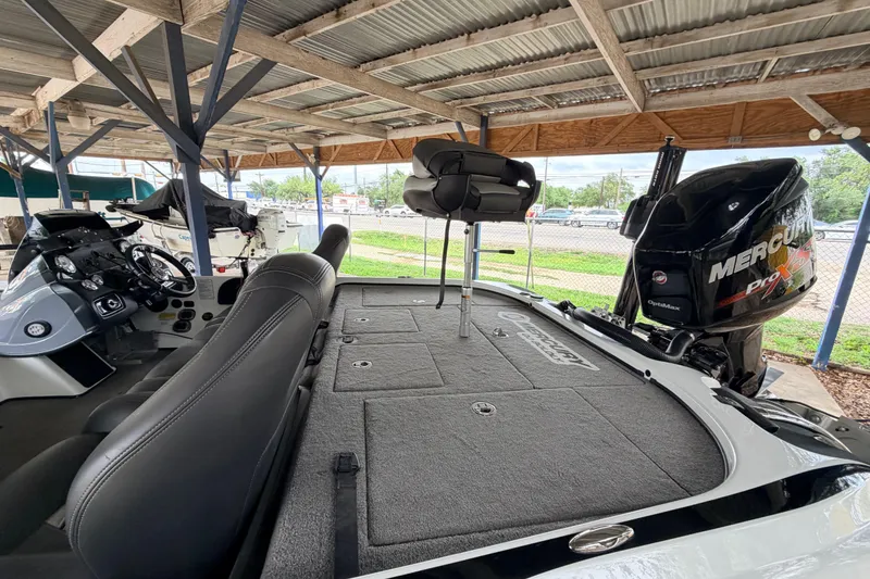 Slide: The Image of 2016 Nitro Z20 boat with Mercury Pro XS engine under a metal canopy. - 13