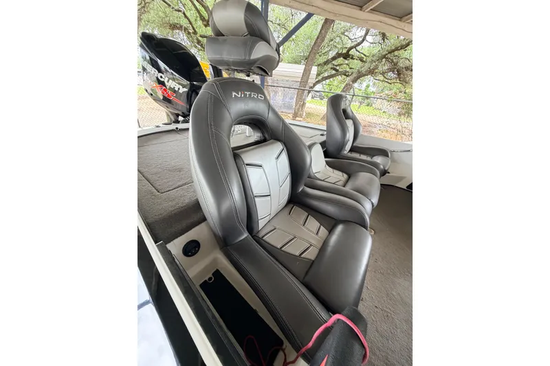 Slide: The Image of 2016 Nitro Z20 boat interior with leather seats and Mercury engine in background. - 15