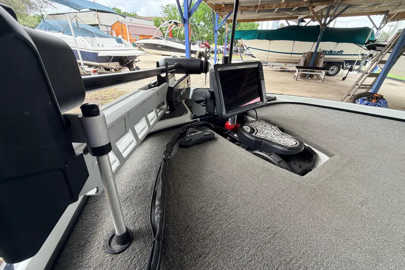 Slide: The Image of 2016 Nitro Z20 boat interior with navigation equipment and carpeted deck. - 5