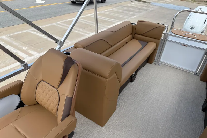Slide: The Image of 2026 Avalon VENTURE QUAD LOUNGE interior with tan seating and modern design. - 16