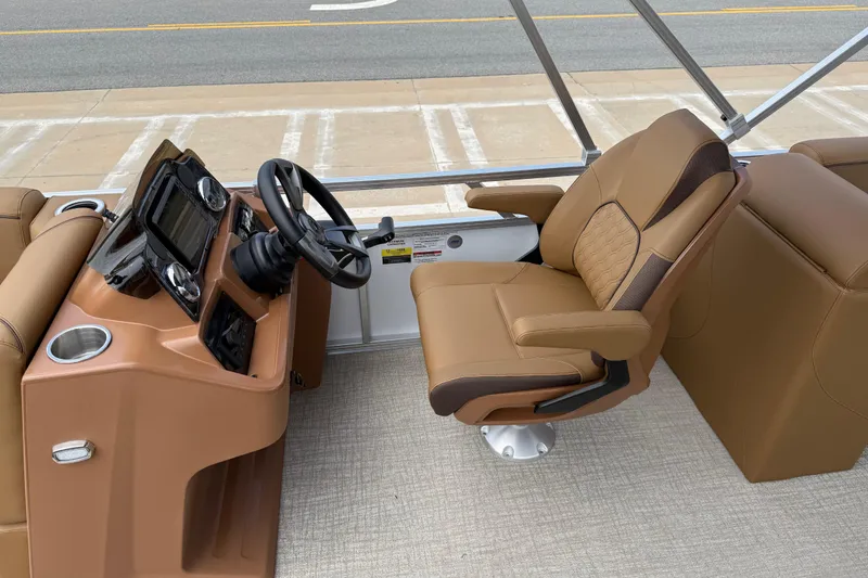 Slide: The Image of Luxurious helm seat and console of 2026 Avalon VENTURE QUAD LOUNGE pontoon boat. - 17