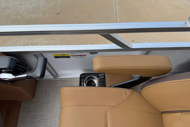 Slide: The Image of 2026 Avalon VENTURE QUAD LOUNGE interior with tan seating and cup holder. - 22