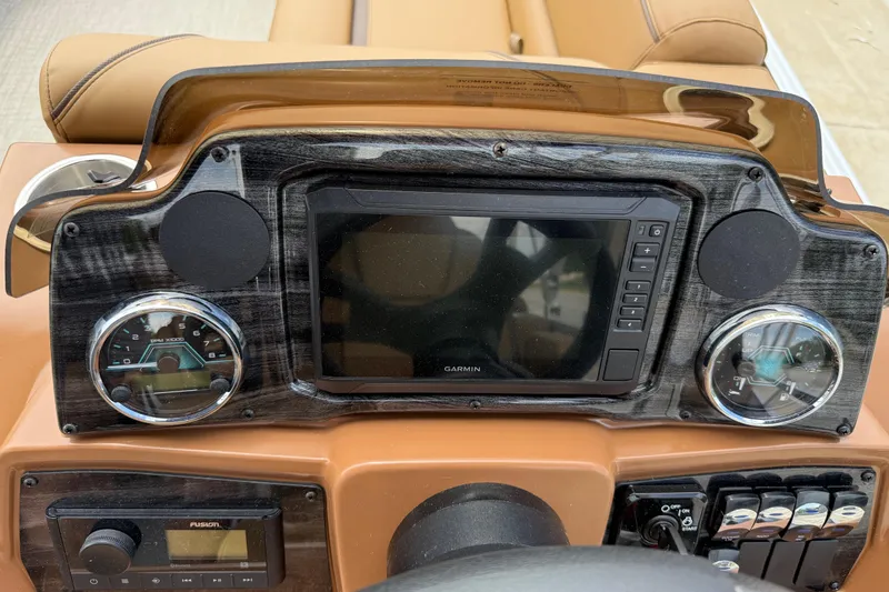 Slide: The Image of Dashboard of 2026 Avalon VENTURE QUAD LOUNGE with Garmin display and controls. - 23