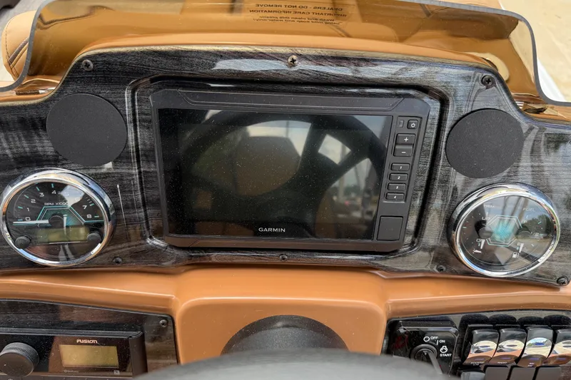 Slide: The Image of Dashboard of 2026 Avalon VENTURE QUAD LOUNGE with Garmin display and gauges. - 26