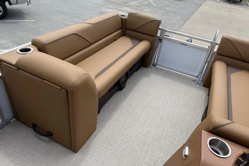 Slide: The Image of 2026 Avalon VENTURE QUAD LOUNGE interior with tan seating and cup holders. - 27