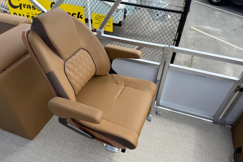 Slide: The Image of Luxurious tan seating on 2026 Avalon VENTURE QUAD LOUNGE boat, showcasing comfort and style. - 29