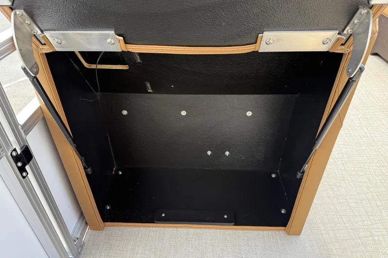 Slide: The Image of Storage compartment of 2026 Avalon VENTURE QUAD LOUNGE, featuring durable materials and secure hinges. - 48