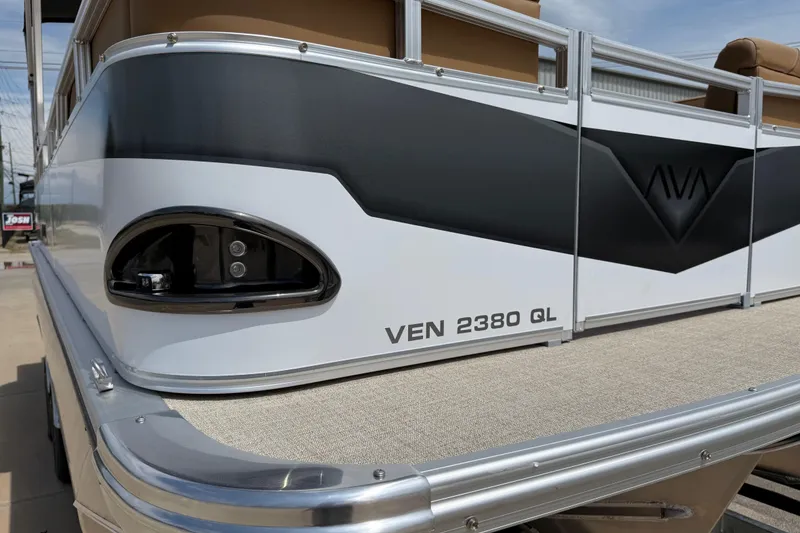 Slide: The Image of 2026 Avalon VENTURE QUAD LOUNGE pontoon boat, model VEN 2380 QL, with sleek design details. - 54