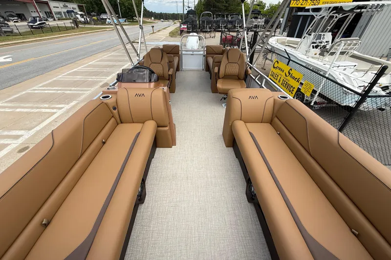 Slide: The Image of 2026 Avalon VENTURE QUAD LOUNGE pontoon boat with luxurious tan seating and spacious layout. - 8