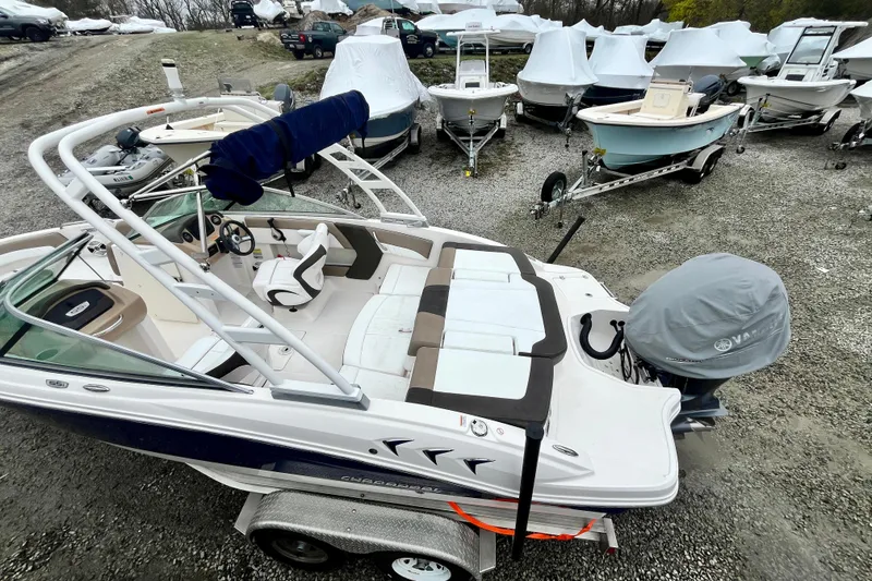 Slide: The Image of 2021 Chaparral 21 SSi OB boat on trailer in a storage yard. - 10