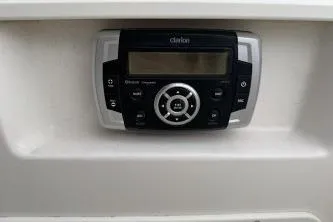 Slide: The Image of Clarion stereo system on 2021 Chaparral 21 SSi OB boat dashboard. - 12