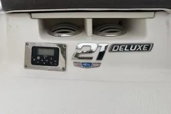 Slide: The Image of 2021 Chaparral 21 SSi OB Deluxe dashboard with control panel and emblem. - 14