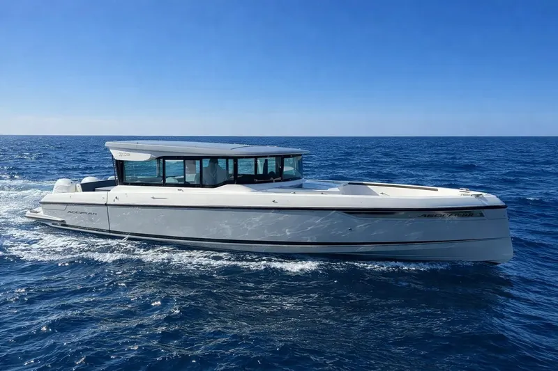 Slide: The Image of 2025 Saxdor 320 GTC cruising on open sea under clear blue sky. - 10