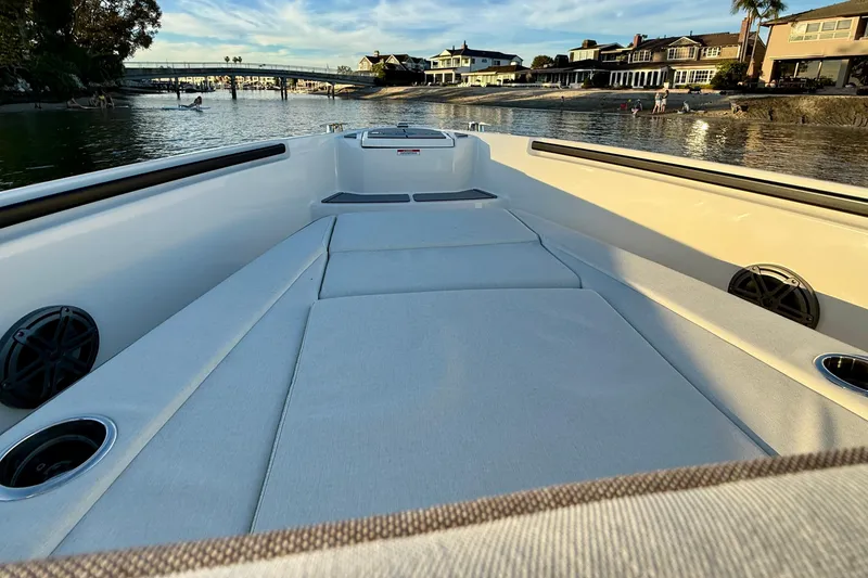 Slide: The Image of 2025 Saxdor 320 GTC boat interior with waterfront view, featuring spacious seating and modern design. - 13