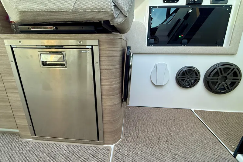 Slide: The Image of 2025 Saxdor 320 GTC interior with stainless steel fridge and audio system. - 32