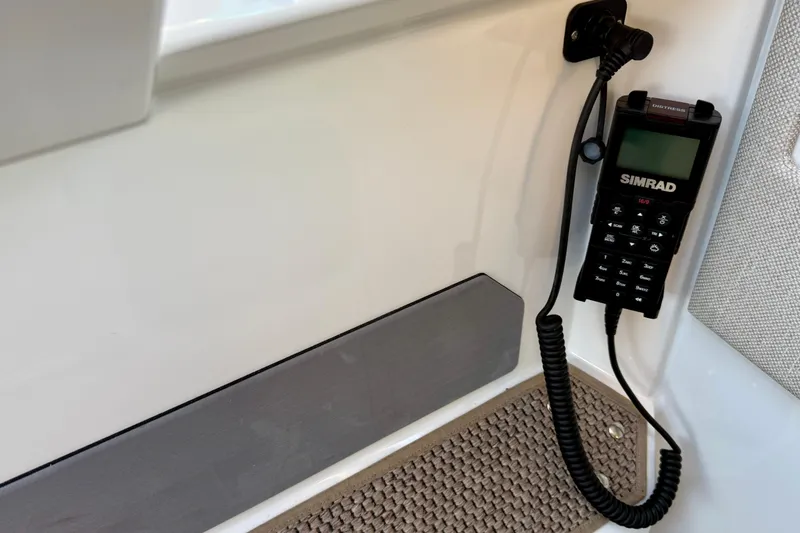 Slide: The Image of Simrad radio installed on 2025 Saxdor 320 GTC boat interior. - 37