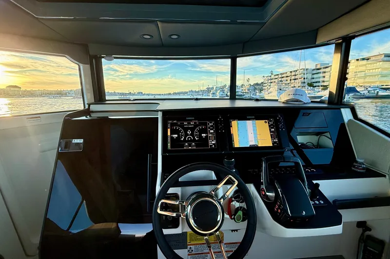 Slide: The Image of Interior view of 2025 Saxdor 320 GTC boat cockpit with modern navigation displays. - 41