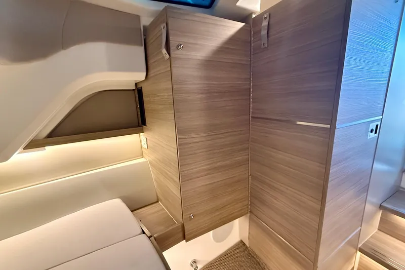 Slide: The Image of Interior of 2025 Saxdor 320 GTC, featuring modern wood cabinetry and sleek design. - 44