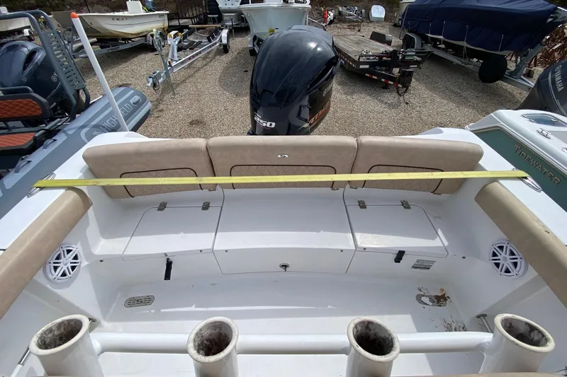 Slide: The Image of 2019 Sportsman Heritage 231 Center Console boat interior with seating and storage compartments. - 14