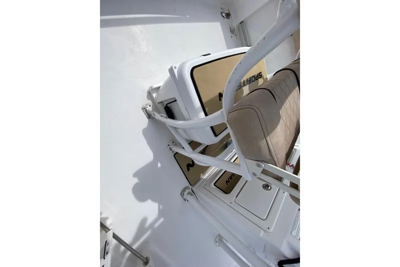 Slide: The Image of 2019 Sportsman Heritage 231 Center Console interior with cushioned seating and storage compartments. - 15