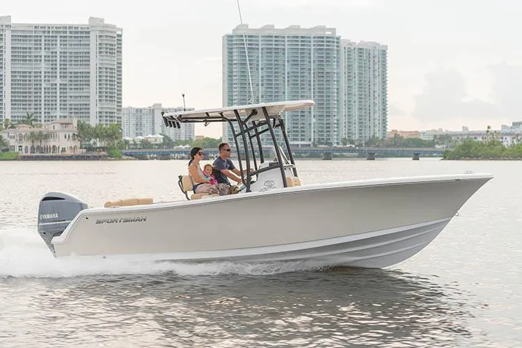 Slide: The Image of 2019 Sportsman Heritage 231 Center Console on water with skyscrapers in background. - 7